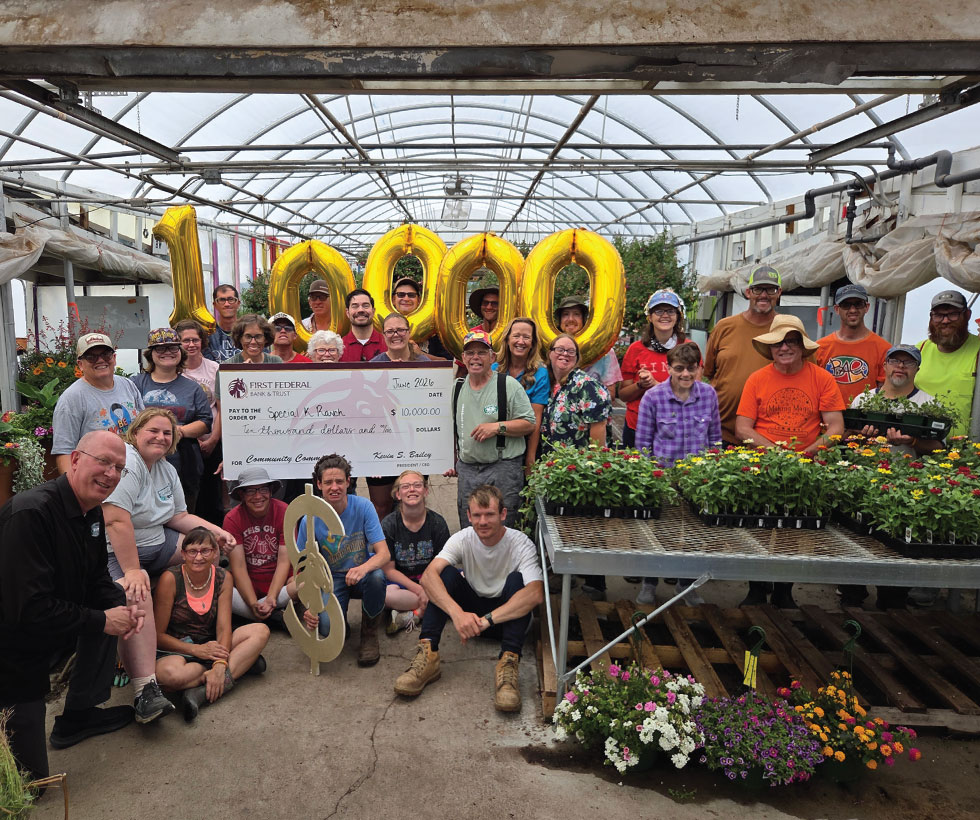 First Federal employees presenting a donation check to members of Special K Ranch.