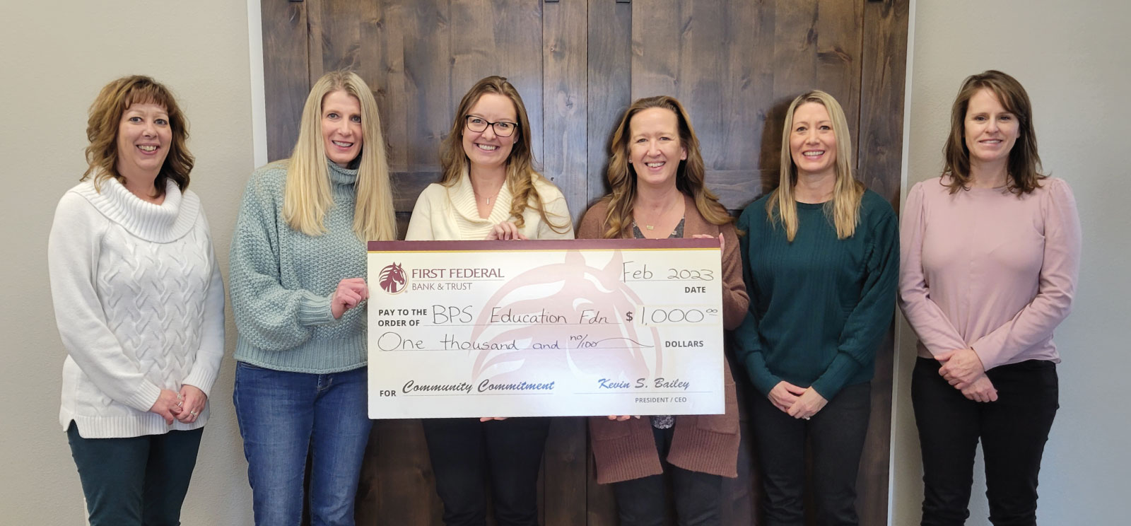 Members of First Federal present a check to Billings Public Schools Education Foundation