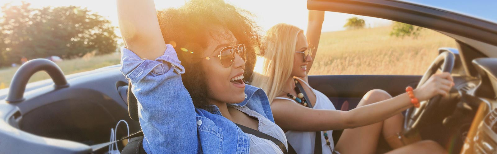 Two ladies in a new car