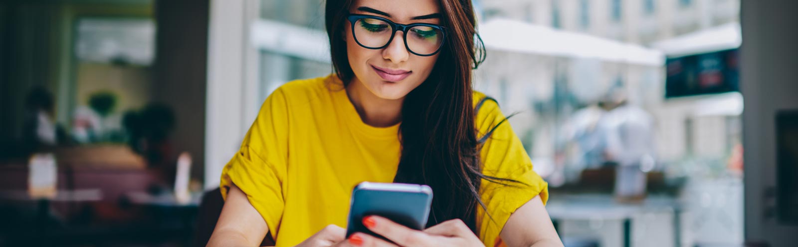 Lady in an office using her smartphone