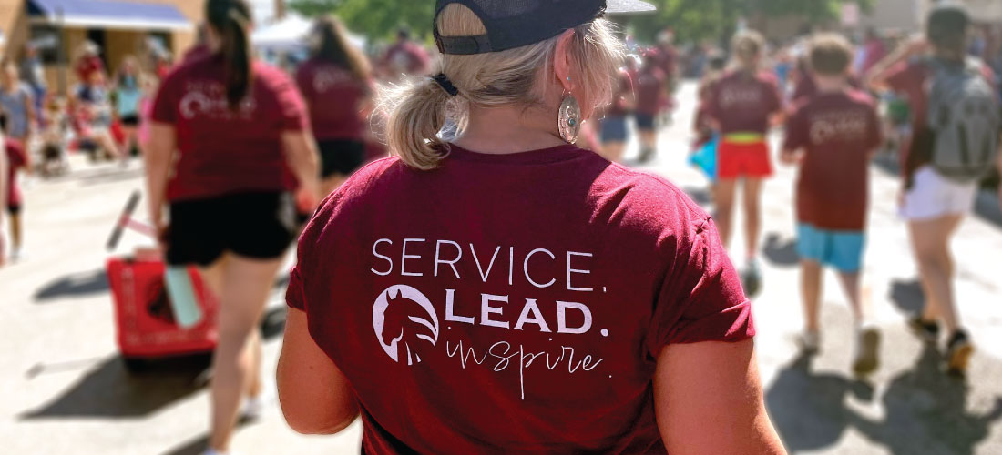 First Federal employee wearing a Service. Lead. Inspire. shirt