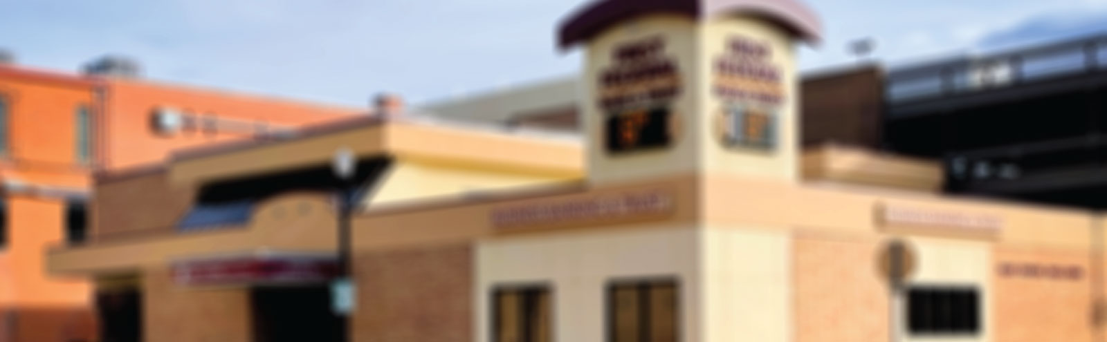 Blurred image of Downtown Business & Trust building in Sheridan, WY.