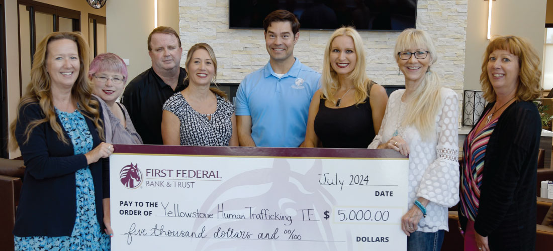Group of people holding a donation check for Yellowstone Human Trafficking Task Force.