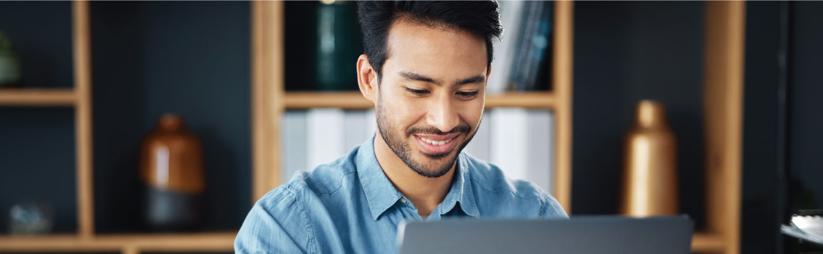 Man working in office on laptop