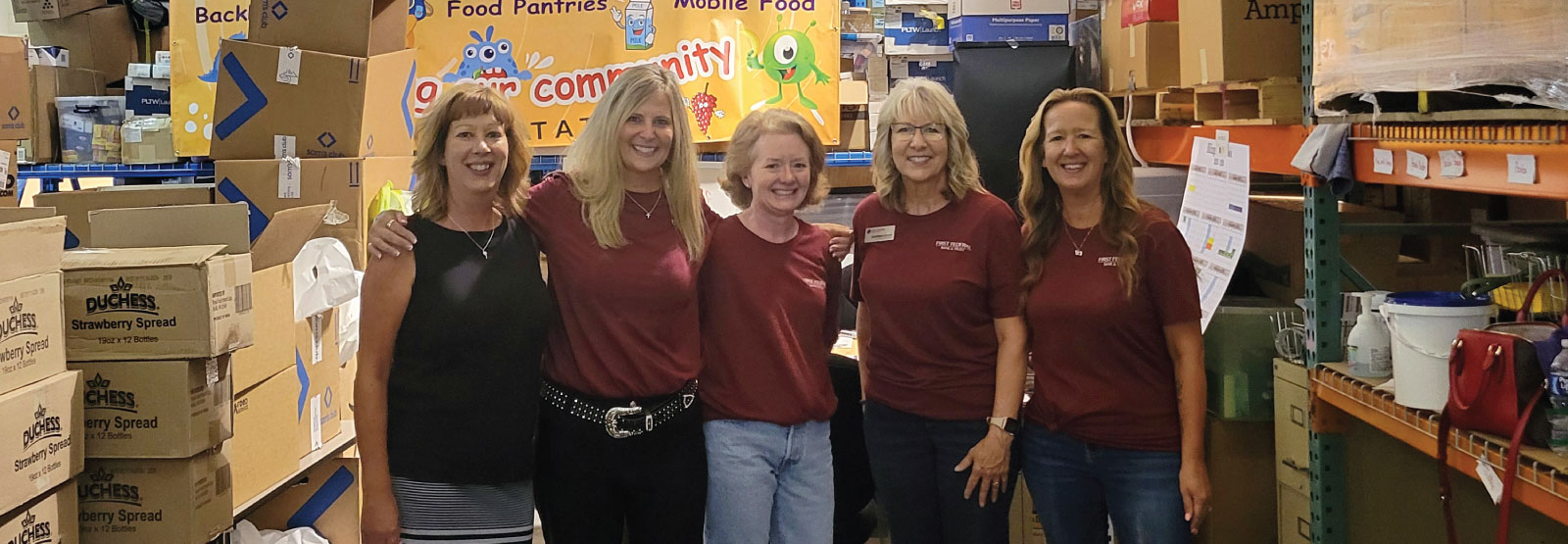 Group of five First Federal team members helping at the Billings Education Foundation.