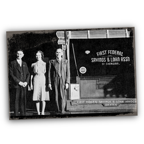 1930s black and white photo of First Federal Founders standing next to original bank.