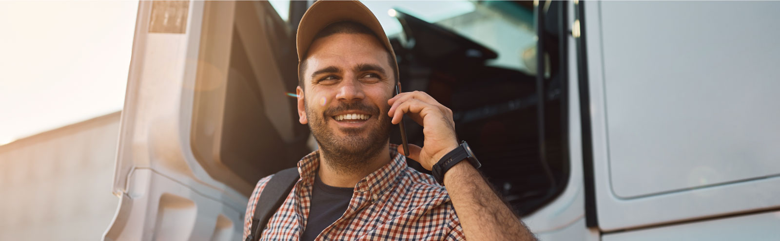 Man on cell phone outside of truck