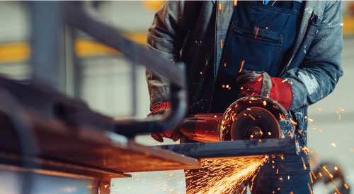 Man using manufacturing equipment