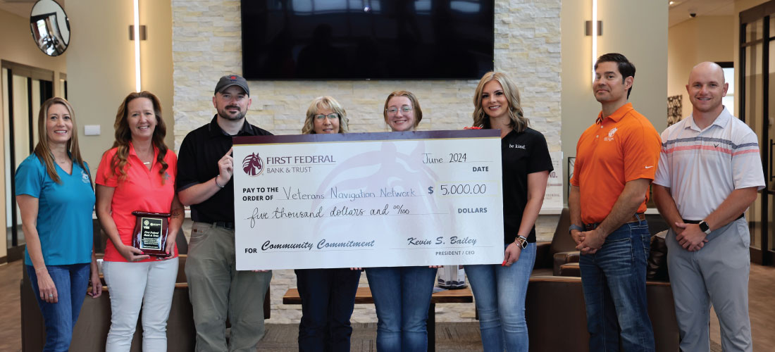 Group of people holding a check for Veterans Navigation Network